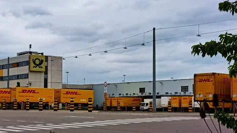 DHL logistics facility with yellow delivery vans in Regensburg, Germany Stock Footage 310537731