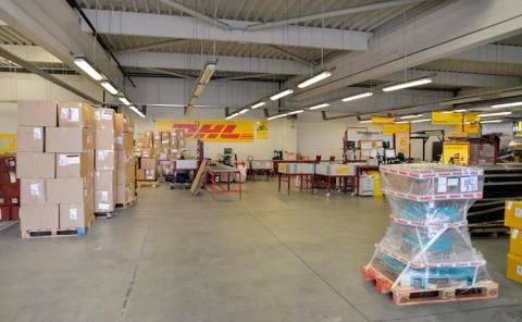 DHL warehouse with package boxes of different size Stock Photos