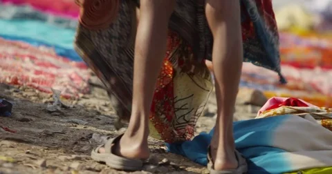 Dhobi Ghat (laundry by hand) using the Yamuna to wash traditional Indian Stock Footage 73414603