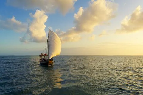 Dhow at sunset and background clouds 写真素材