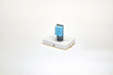 A DHT11 sensor, a temperature and humidity sensor, embedded in a project boar Stock Photos