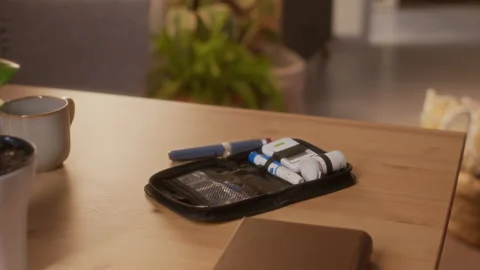 Diabetes Testing Kit Lying on Kitchen Table at Home Stock Footage 320968231