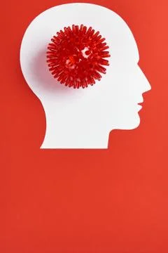 Diagnostics concept with strain virus model and human's head isolated on red Stock Photos