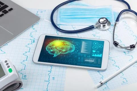 Diagnostics on tablet with brain functionality concept Stock Photos