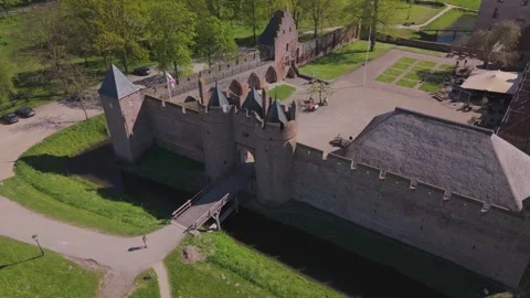 Diagonal aerial pullback reveal of Doornenburg Castle Stock Footage 334318946