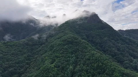 Diagonal Ascending Drone Shot of Mountain Peak and Mist, South Korea Stock Footage 345867540