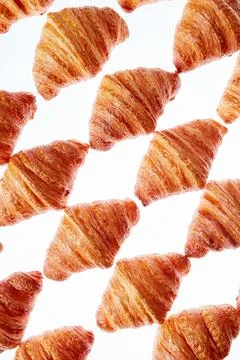 Diagonal baked goods pattern on a light background. Stock Photos