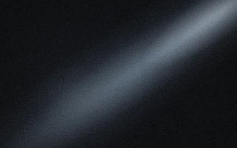Diagonal beam of light on a dark textured background, with visible grain, a.. Stock Photos