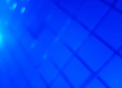 Diagonal blue grid bokeh background Illustrazione stock