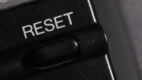 Diagonal Close Up Of Reset Button Pressed For Fresh Start 動画素材 332564060