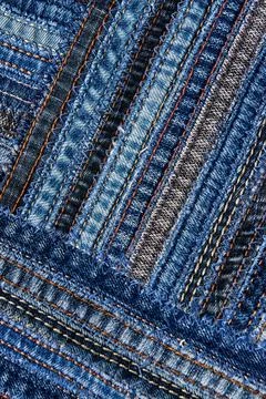 Diagonal denim fabric pattern in patchwork style. Stock Photos
