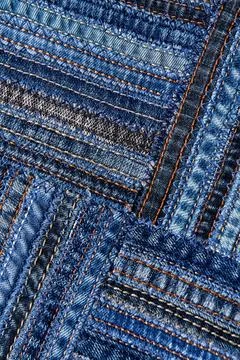 Diagonal denim fabric pattern in patchwork style. Stock Photos