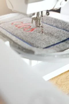 Diagonal detail view on a modern computerised sewing  and embroidery machine Stock Photos