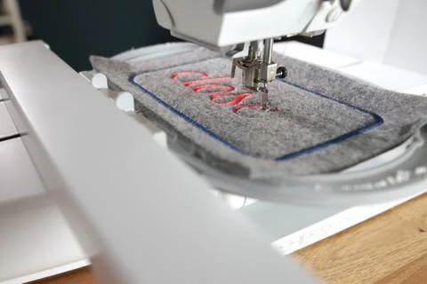Diagonal detail view on a modern computerised sewing and embroidery machine Stock Photos