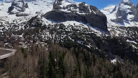 Diagonal Drone Glide Tracking Across Glacial Bowls and Pine Forest Slope Stock Footage 339661595