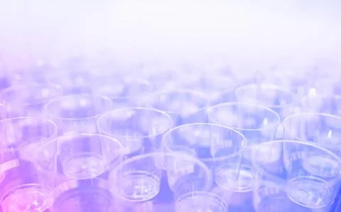 Diagonal empty glasses on stand-up party background Foto stock