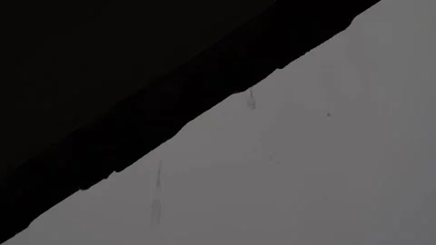 Diagonal Frame of Sky and Rooftop with Raindrops Falling, Capturing Serenity 스톡 동영상 295970152