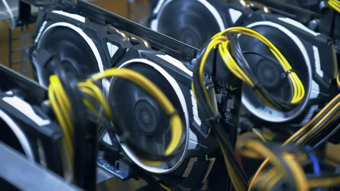 Diagonal graphics cards and yellow cables inside open GPU mining rig Stock Footage 343916391