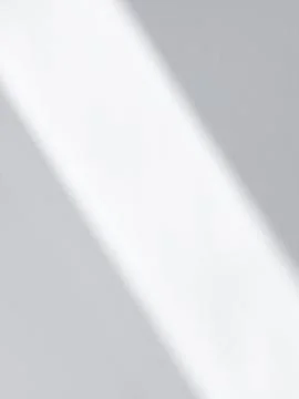 Diagonal Light and Shadow Play on a White Surface Stock Photos