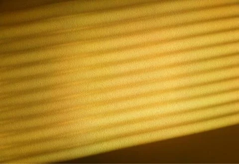 Diagonal light rays though Venetian blinds background 스톡 사진