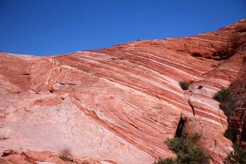 Diagonal lines designed by the erosion on the red rocks of the Valley of Fire Stock Photos