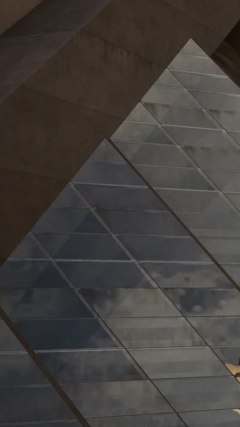 Diagonal lines intersecting at a modern building with textured surfaces Stock Footage 341983031