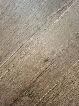 Diagonal macro view of light brown oak laminate flooring with clear grain p.. Stock Photos