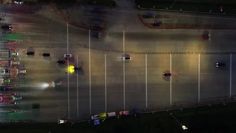 Diagonal night view of toll exit with vehicle flow Stock-Footage 306199260