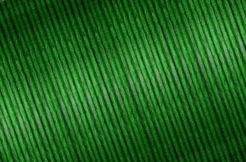 Diagonal parallel lines form a patterned green texture, resembling closely .. Illustrazione stock