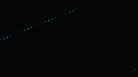A diagonal path of glowing blue lights set against a deep black background Stock Footage 339615334