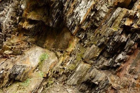 Diagonal rock material texture. Macro of old mountain stones pattern background Stock Photos