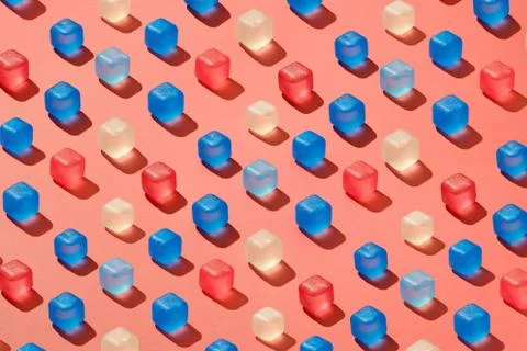 Diagonal rows pattern from colored plastic ice cubes on a background in a trend Foto stock