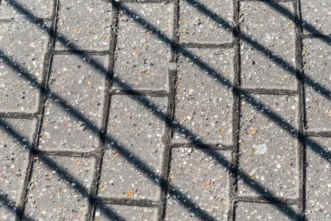 Diagonal shadows on the pavement Foto stock