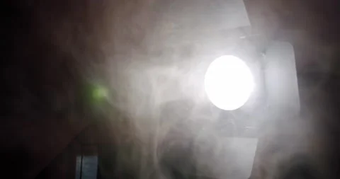 Diagonal spot light and smoke cloud shiny lighting lamp rays effect dynamic Stock Footage 139843375