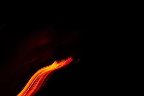 Diagonal trail of fire in the darkness Stock Photos