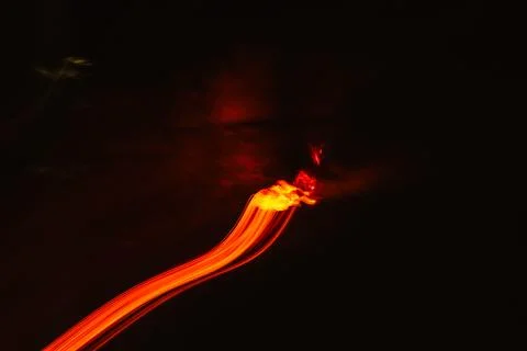 Diagonal trail of fire in the darkness Stock Photos