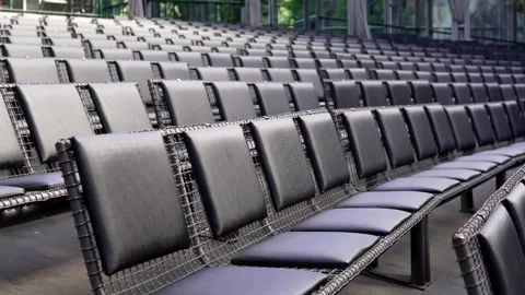 Diagonal view of multiple rows of empty black chairs inside the Opera de Arame t 스톡 동영상 277464264
