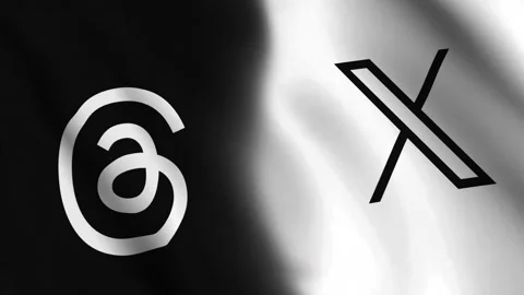 Diagonal waving flag of Threads app and X (Formerly Twitter) logo Stock Footage 247551922
