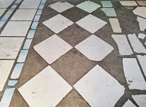 Diagonal white tile layout with concrete contrast for outdoor path walkway .. Stock Photos