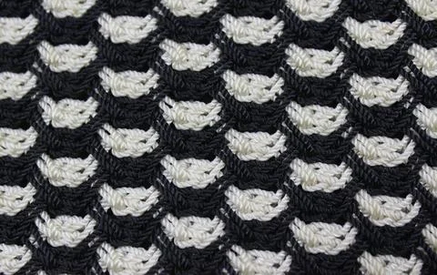 Diagonally angled interweaving threads of fabric on a woman's handbag, in b.. Stock Photos