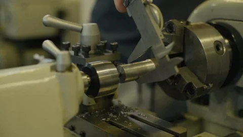 Dial caliper taking measurement of part Stock Footage 103337044