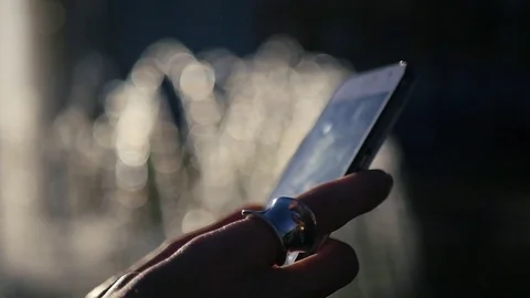 Dial a message on the phone, with a blurry background, close-up. HD, 1920x1080 Stock Footage 83128908