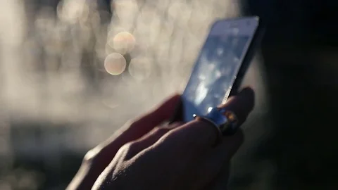 Dial a message on the phone, with a blurry background, close-up. HD, 1920x1080 Video stock 83128952