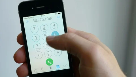 Dial the number on the touch screen of the smartphone. Call by phone number. Mac Stock Footage 107917573