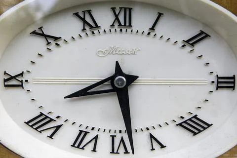 Dial of an old analog soviet clock Stock Photos