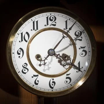 Dial of an old pendulum clock with beautiful figures Stock Photos
