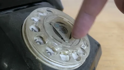 Dialing a number on dusty, rusty old rotary phone. Macro view Stock Footage 96002611