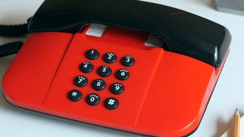 Dialing A Number On A Red Push-button Phone. 스톡 동영상 106012814