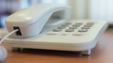 Dialing a number on a telephone Stock Footage 11942196
