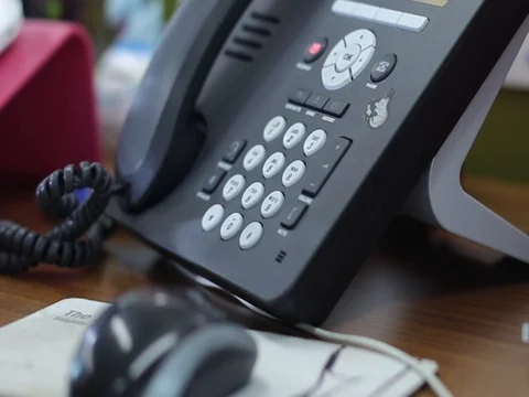 Dialing from an office phone. Stock Footage